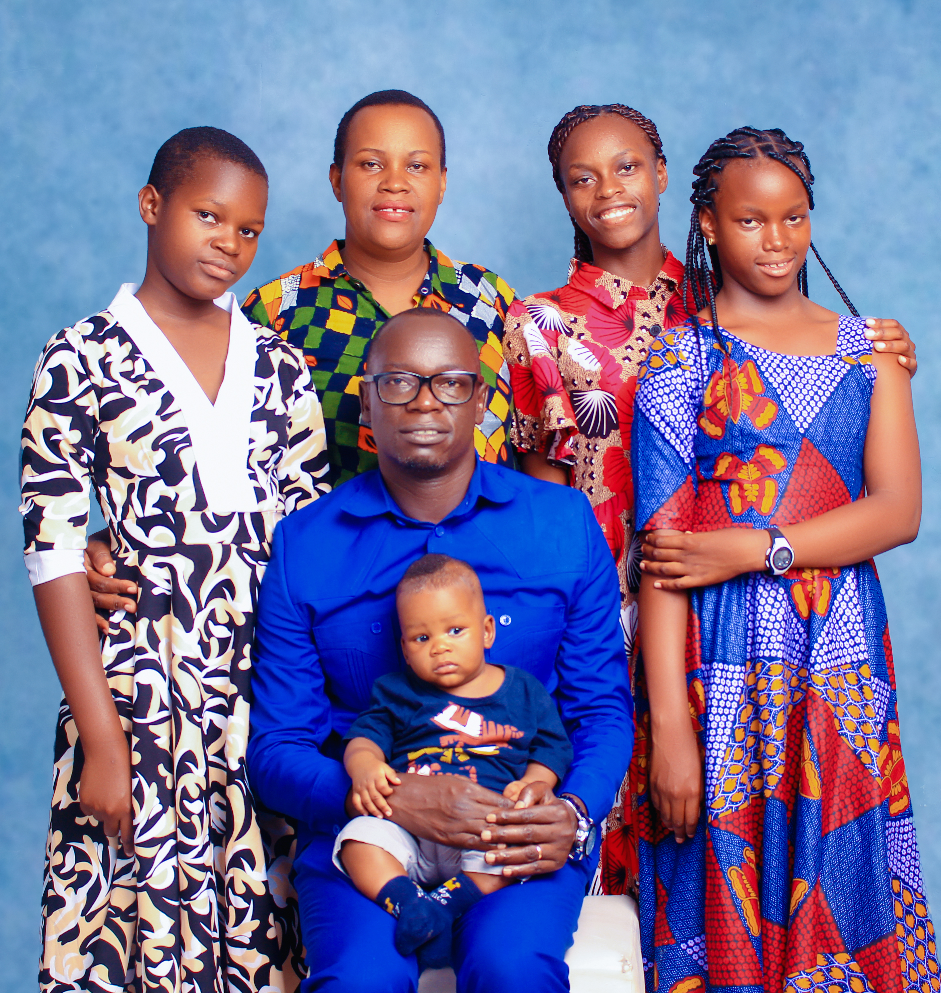 Deusdedit (Deus) Kanunu and his wife, Ezena and their three children 